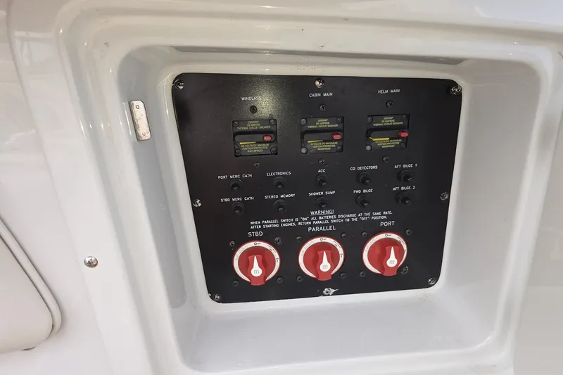 Slide: The Image of Control panel of a 2017 Crownline 325 SCR boat with switches and dials. - 22