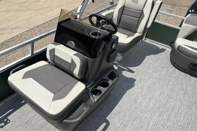 Slide: The Image of 2026 Sun Tracker Bass Buggy 16 XL Select interior with seating and steering console. - 7