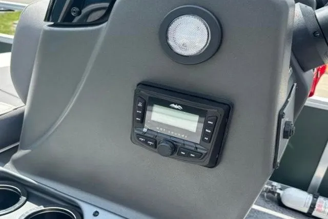 Slide: The Image of Dashboard of 2026 Sun Tracker Bass Buggy 16 XL Select with audio controls and speaker. - 12