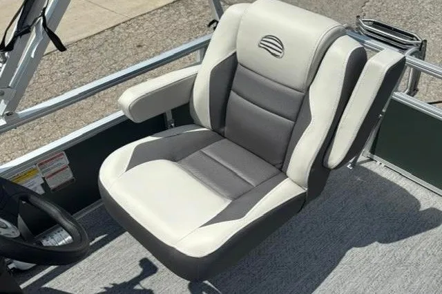 Slide: The Image of 2026 Sun Tracker Bass Buggy 16 XL Select boat seat, featuring gray and white upholstery. - 13