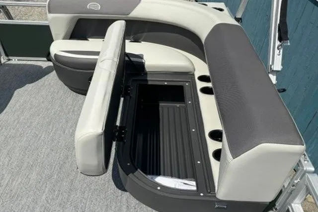 Slide: The Image of 2026 Sun Tracker Bass Buggy 16 XL Select pontoon boat seating with storage compartment. - 9