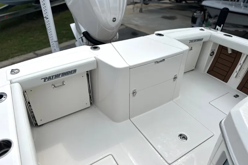 Slide: The Image of 2027 Pathfinder 2400 Tournament boat interior with storage compartments and seating. - 9