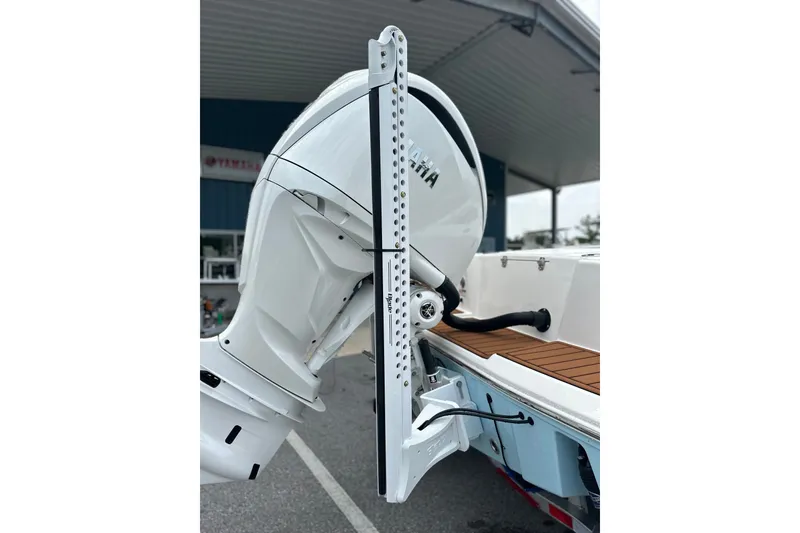 Slide: The Image of 2027 Pathfinder 2400 Tournament boat with Yamaha outboard motor, docked under a canopy. - 25