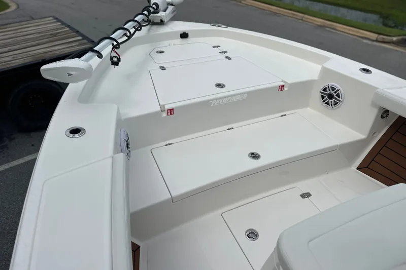 Slide: The Image of 2027 Pathfinder 2400 Tournament boat deck with storage compartments and speaker. - 14