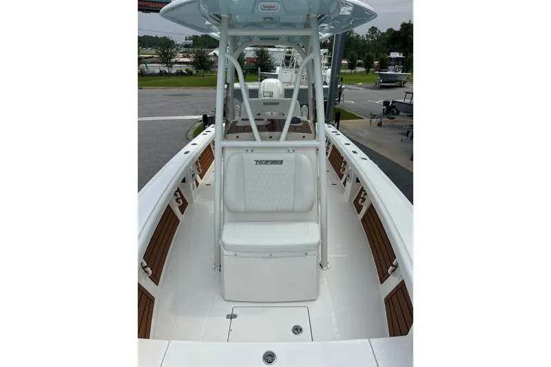 Slide: The Image of 2027 Pathfinder 2400 Tournament boat with sleek white deck and seating. - 12