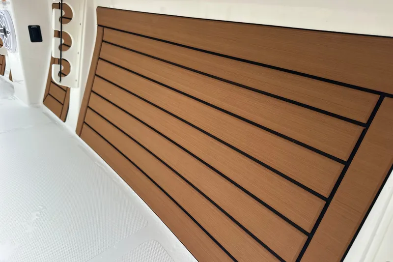 Slide: The Image of Interior view of 2027 Pathfinder 2400 Tournament boat with wood paneling. - 11