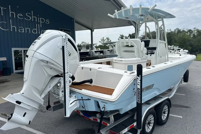 Slide: The Image of 2027 Pathfinder 2400 Tournament boat with Yamaha outboard motor, parked at a marina. - 31