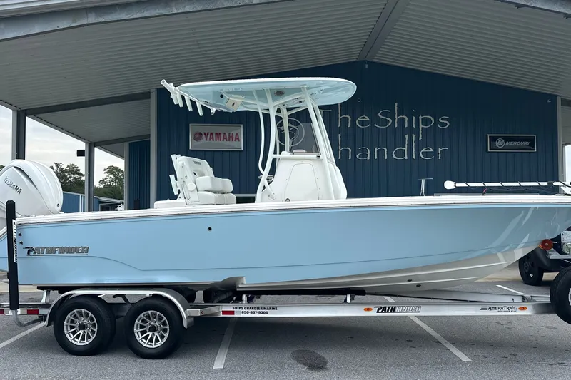 The Image of 2027 Pathfinder 2400 Tournament boat on trailer at dealership. - 0