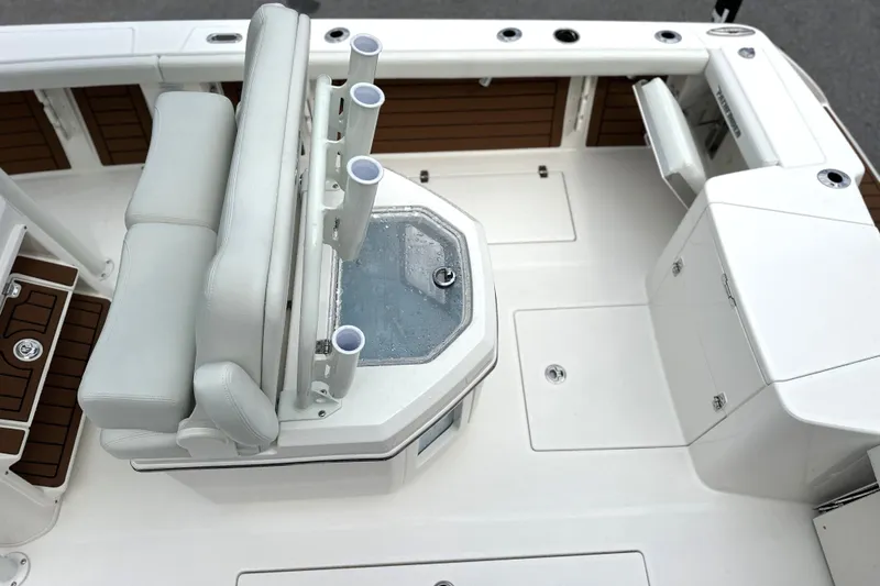 Slide: The Image of 2027 Pathfinder 2400 Tournament boat interior with seating and storage compartments. - 18