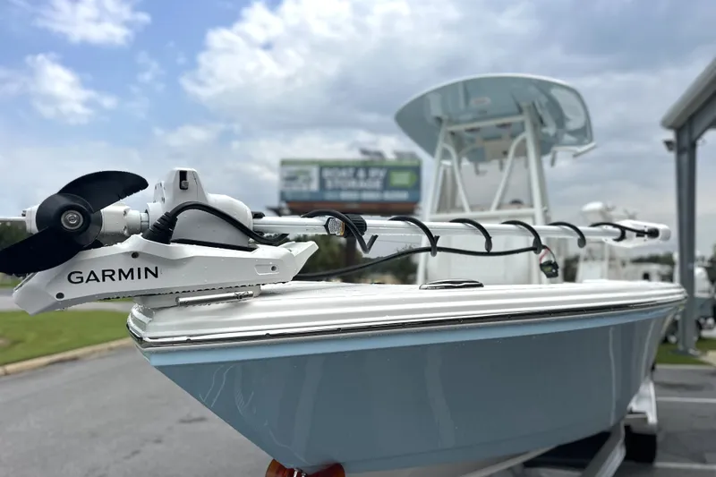 Slide: The Image of 2027 Pathfinder 2400 Tournament boat with Garmin equipment, displayed outdoors under cloudy sky. - 22