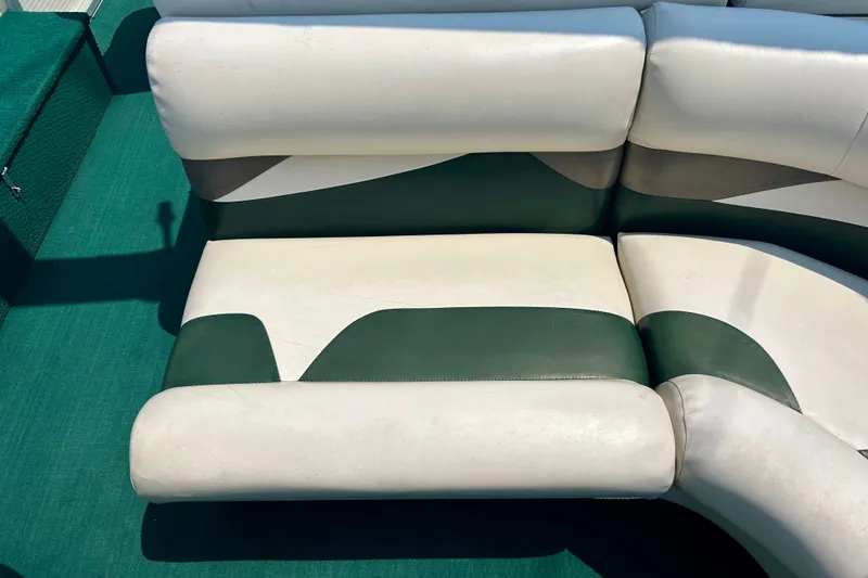 Slide: The Image of White and green seating on a 2003 Misty Harbor 2080CF boat. - 32
