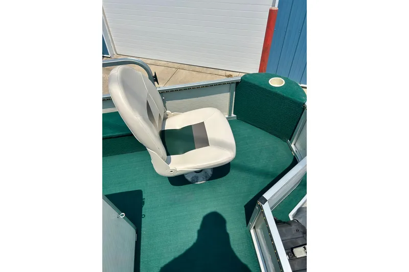 Slide: The Image of 2003 Misty Harbor 2080CF boat interior with green carpet and white seat. - 40