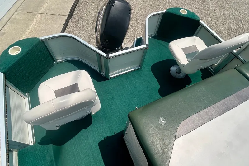 Slide: The Image of 2003 Misty Harbor 2080CF boat interior with green carpet and white seats. - 38