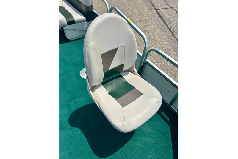 Slide: The Image of 2003 Misty Harbor 2080CF boat seat with green and white upholstery on deck. - 16