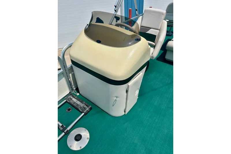 Slide: The Image of 2003 Misty Harbor 2080CF boat console with beige and green accents. - 44