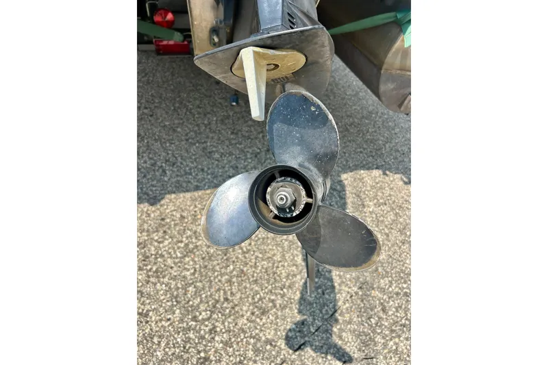 Slide: The Image of Propeller of a 2003 Misty Harbor 2080CF boat on pavement background. - 12