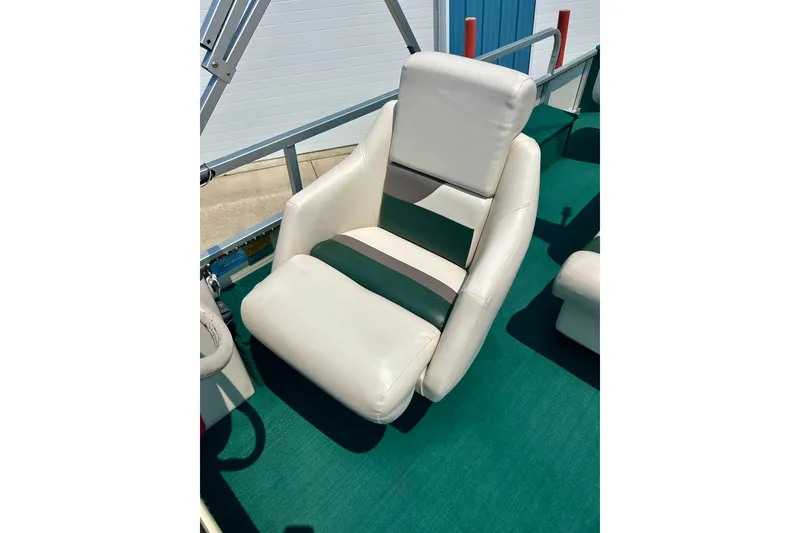 Slide: The Image of White and green boat seat on 2003 Misty Harbor 2080CF pontoon. - 21