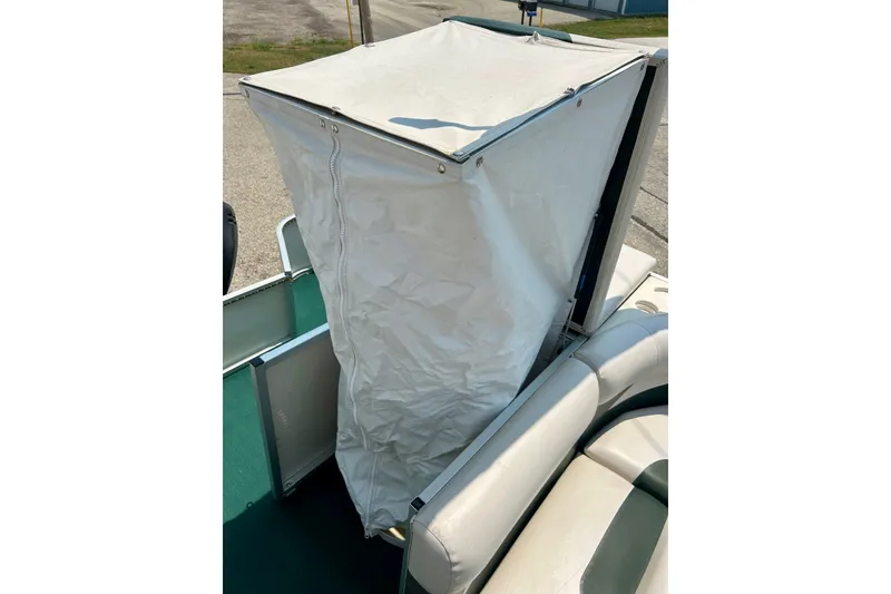 Slide: The Image of 2003 Misty Harbor 2080CF boat with white canvas enclosure. - 37