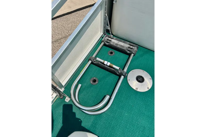 Slide: The Image of 2003 Misty Harbor 2080CF boat interior with green carpet and metal fittings. - 19