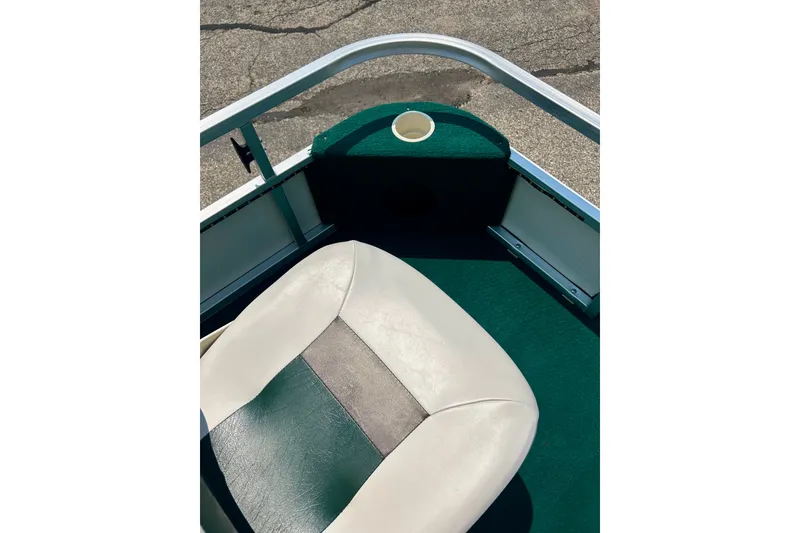 Slide: The Image of 2003 Misty Harbor 2080CF boat interior with green and white seating. - 17