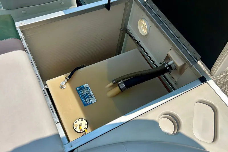 Slide: The Image of Open storage compartment in a 2003 Misty Harbor 2080CF boat, showing internal components. - 35