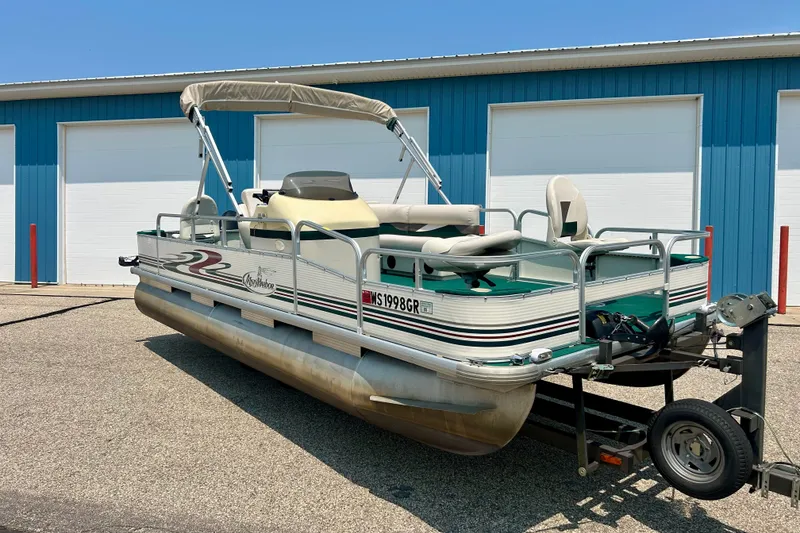 Slide: The Image of 2003 Misty Harbor 2080CF pontoon boat parked outside blue garage doors. - 4