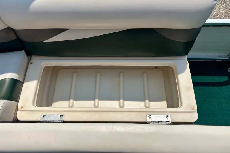 Slide: The Image of Storage compartment on a 2003 Misty Harbor 2080CF boat seat, open and empty. - 29