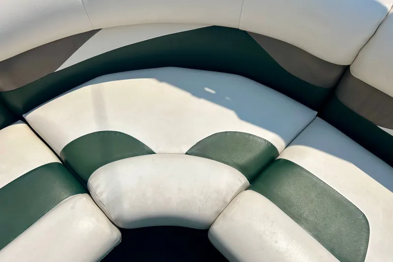 Slide: The Image of 2003 Misty Harbor 2080CF boat seating with green and white upholstery. - 30