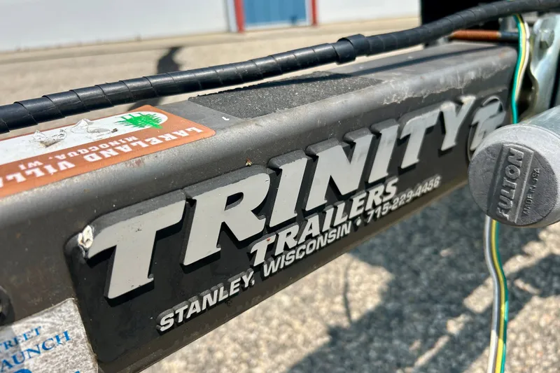 Slide: The Image of Close-up of Trinity Trailers hitch, Stanley, Wisconsin, with visible wiring and stickers. - 46