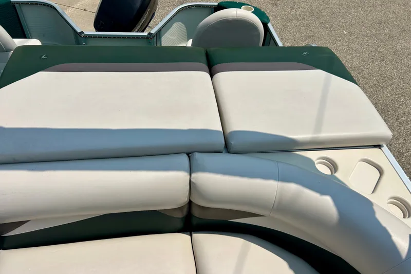 Slide: The Image of 2003 Misty Harbor 2080CF boat interior with cushioned seating and cup holders. - 34