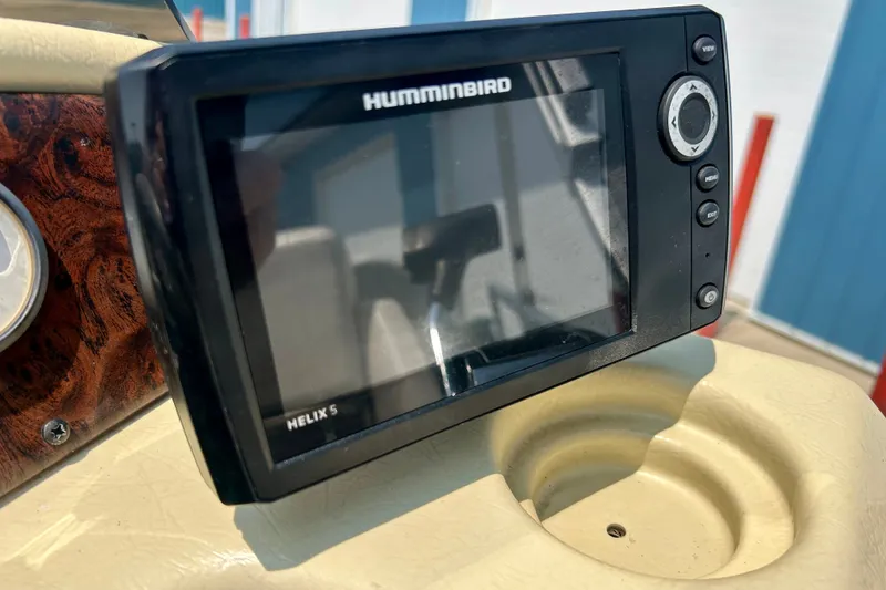 Slide: The Image of Humminbird Helix 5 fish finder on 2003 Misty Harbor 2080CF boat dashboard. - 27