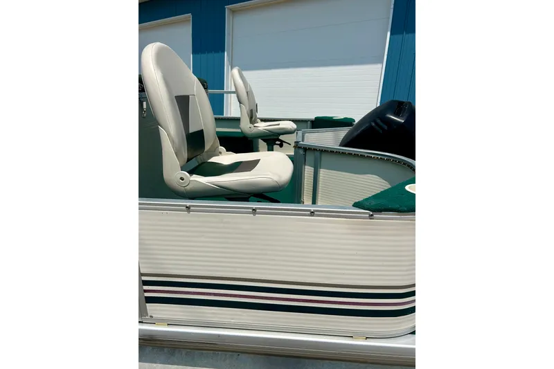 Slide: The Image of 2003 Misty Harbor 2080CF boat with white seats and striped exterior. - 10