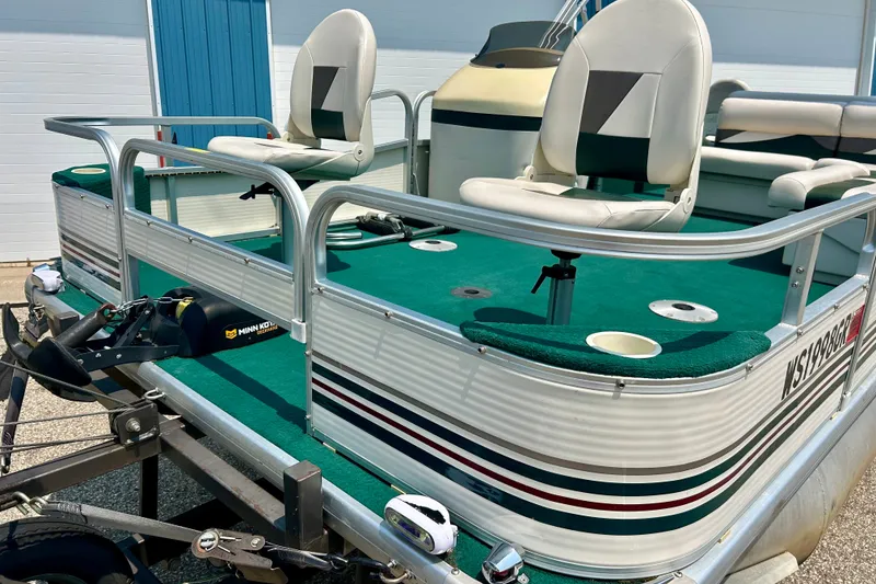 Slide: The Image of 2003 Misty Harbor 2080CF pontoon boat with green carpet and swivel seats. - 9