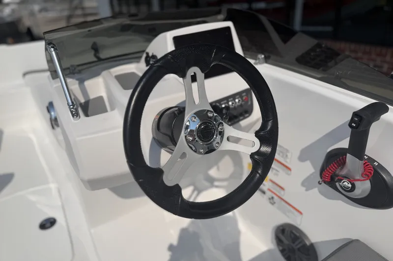 Slide: The Image of Steering console of 2027 Tahoe T16 boat with modern controls and sleek design. - 10
