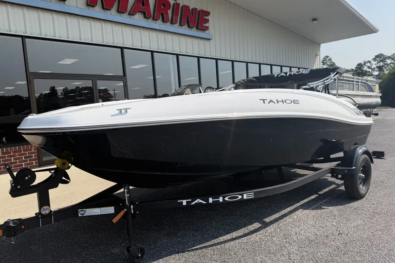 Slide: The Image of 2027 Tahoe T16 boat on trailer outside marine dealership. - 5