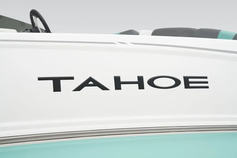 Slide: The Image of Close-up of the Tahoe logo on a white boat. - 48