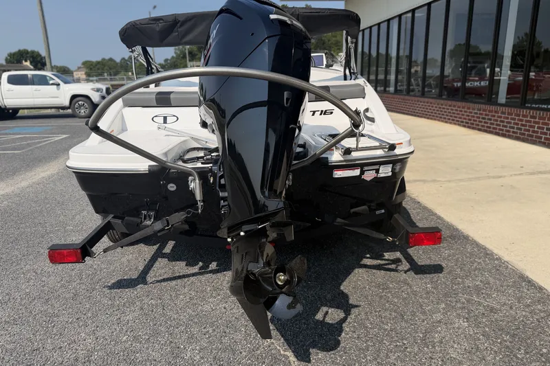 Slide: The Image of 2027 Tahoe T16 boat on trailer, featuring a powerful outboard motor. - 14