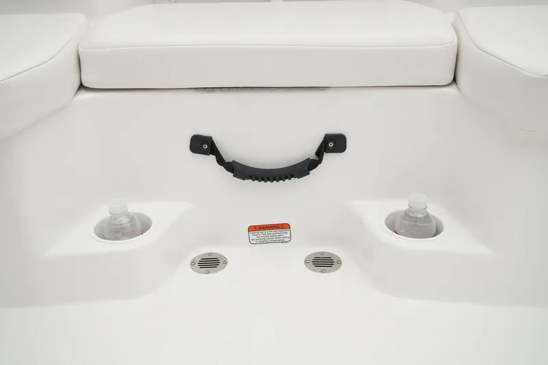 Slide: The Image of The image shows a white boat seat with two cup holders and a black handle. - 41