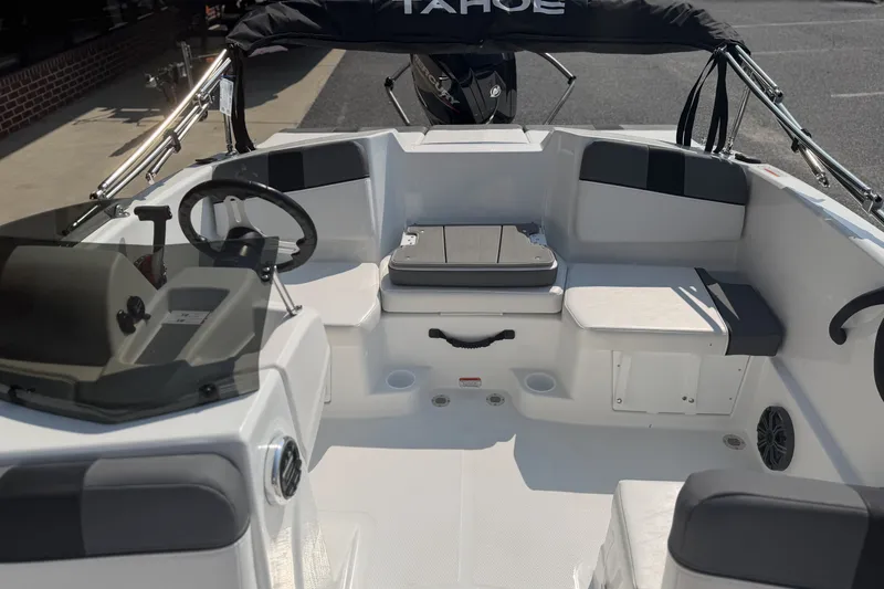 Slide: The Image of 2027 Tahoe T16 boat interior with steering wheel and seating, showcasing modern design. - 7