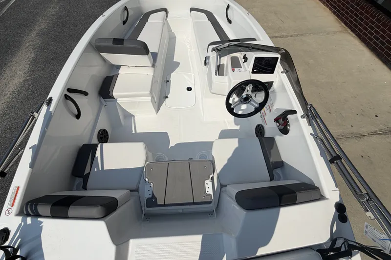 Slide: The Image of 2027 Tahoe T16 boat interior with seating and steering console, viewed from above. - 12