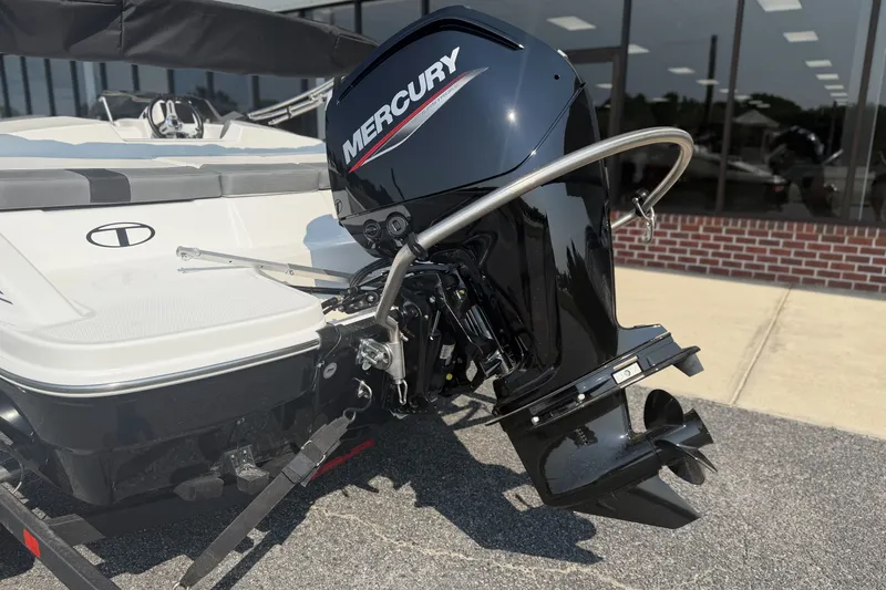 Slide: The Image of 2027 Tahoe T16 boat with Mercury outboard motor, displayed outdoors. - 3