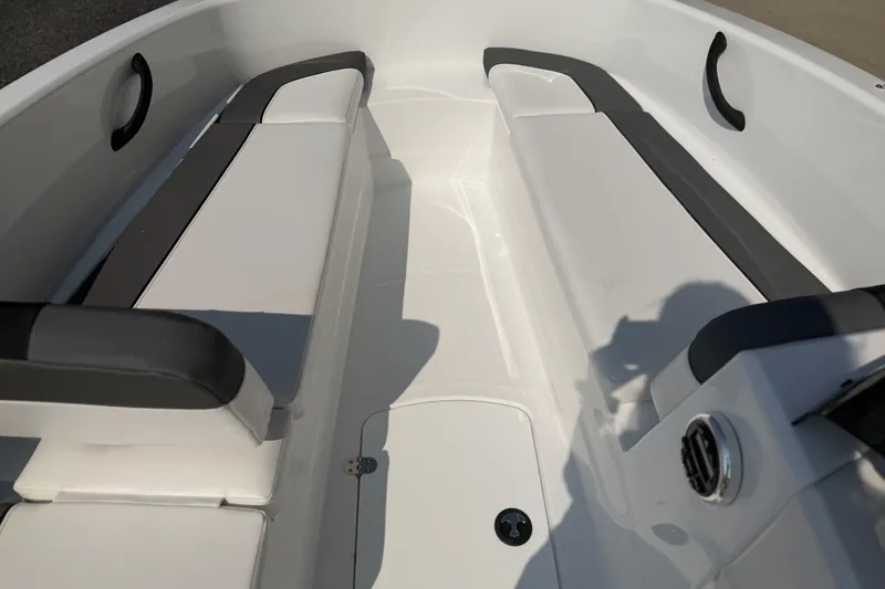 Slide: The Image of Interior view of 2027 Tahoe T16 boat with white seating and black accents. - 6