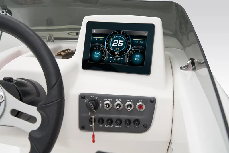 Slide: The Image of The dashboard of a Tahoe T16 boat with a digital display and control switches. - 29