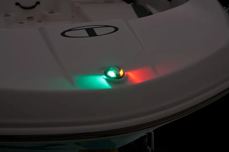 Slide: The Image of The image shows the bow light of a Tahoe T16 boat with red and green navigation lights. - 24