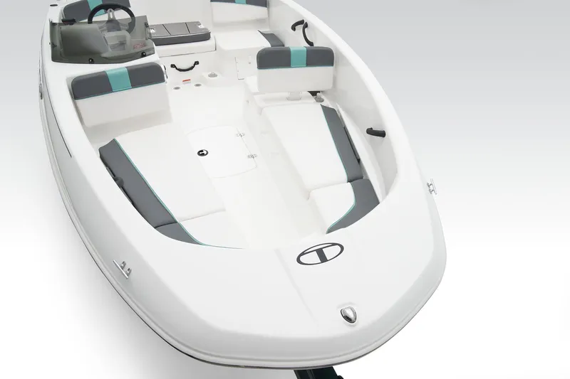 Slide: The Image of A modern white motorboat with gray and turquoise accents. It features seating and a helm console. - 25