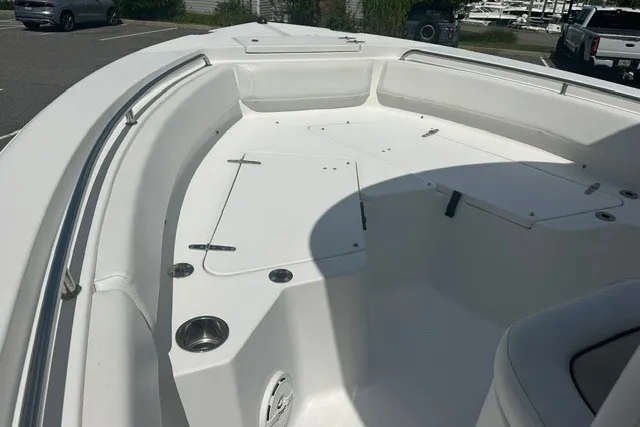 Slide: The Image of 2013 Sea Hunt Ultra 234 boat interior, featuring spacious seating and storage compartments. - 9