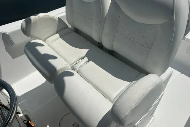 Slide: The Image of White leather seating on a 2013 Sea Hunt Ultra 234 boat. - 7