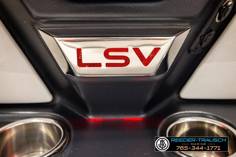 Slide: The Image of 2017 Malibu Wakesetter 25 LSV interior detail with cup holders and LSV emblem. - 47