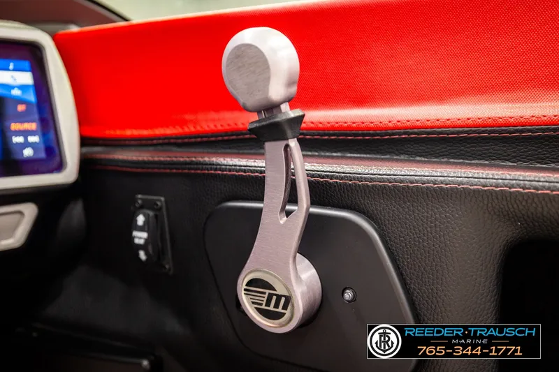 Slide: The Image of 2017 Malibu Wakesetter 25 LSV interior with red and black accents, featuring control lever. - 40