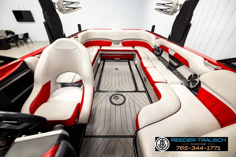 Slide: The Image of Interior of a 2017 Malibu Wakesetter 25 LSV boat with red and white seating. - 18